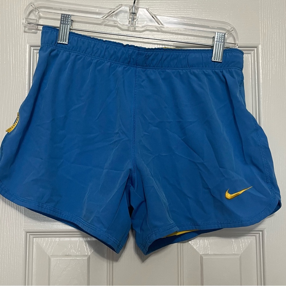 Nike blue shorts with yellow underlining size XS